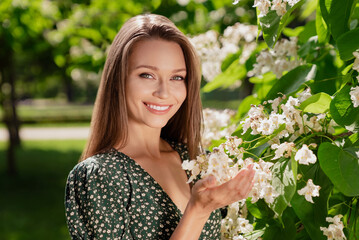 Photo of nice brown haired happy cheerful woman smile spring flowers trees bloom outdoors outside...
