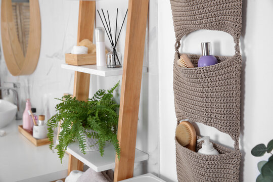 Knitted Organizer Hanging On Wall In Bathroom