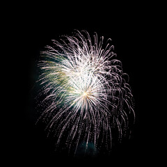 Colorful celebration fireworks isolated on black sky background.