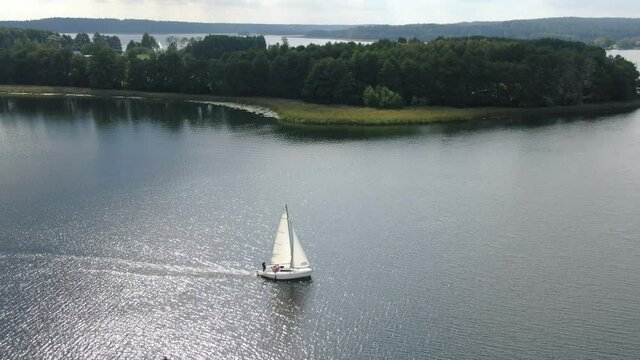 Aerial view of a sailboat on a lake in Masuria (Mazury) region in Poland, Europe