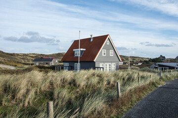 Vacation home in the dunes of the Wadden island Vlieland on a sunny day  in autumn