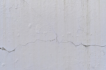 Crack line on white wall as texture background
