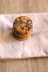 Stack of chocolate chip cookies, tied with ribbon. Selective focus.