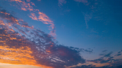 End of the day with a sky between clouds and very colorful, highlighting blue and orange.
