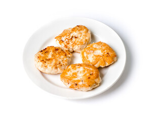 Cutlets in a white plate on a white background. View from above