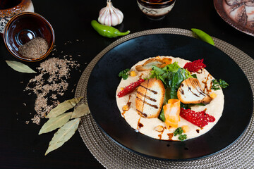 Salad with vegetables and bread on black background