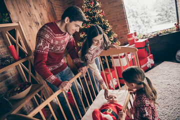 Photo of happy young positive family christmas mood baby son cradle indoors inside house home flat