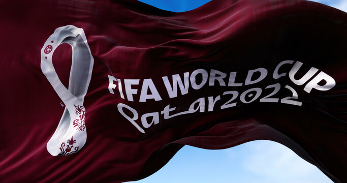 A flag with the 2022 Fifa World Cup logo flapping in the wind