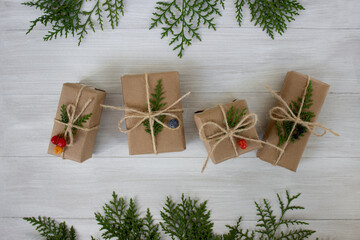  Christmas decorations and gifts on a light background . Environmental wrapping and nature...