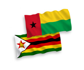Flags of Republic of Guinea Bissau and Zimbabwe on a white background