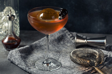 Boozy Cold Manhattan Cocktail with a Big Ice Cube