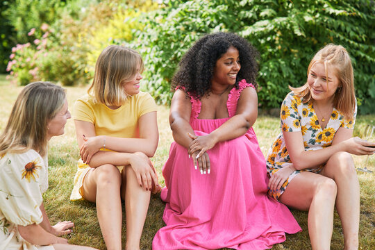 Female friends talking in garden