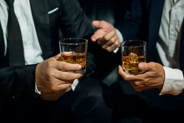 Businessmen in suits drinking  Celebrate whiskey