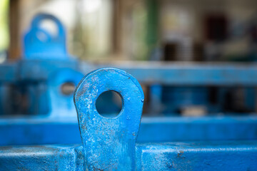 Metal plate pad-eye lifting point of heavy equipment which is use to hook up with shackle for safety lift operation. Industrial object photo. Close-up and selective focus. - obrazy, fototapety, plakaty