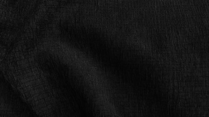Fototapeta na wymiar close up luxury elegance wavy and fold silk fabric texture in dark black color tone. abstract background of fabric with blank space for design.