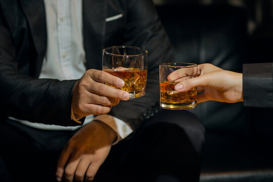 Businessmen In Suits Drinking  Celebrate Whiskey