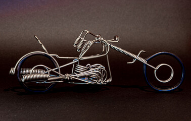 motorcycle made of wire with a dark background