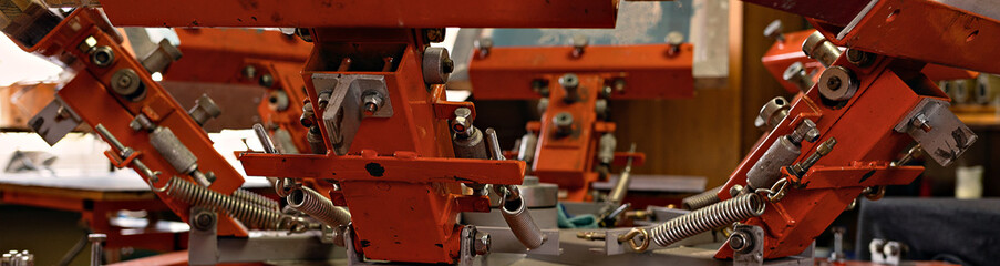 silk screen textile printery banner. print screening apparatus. serigraph printing production