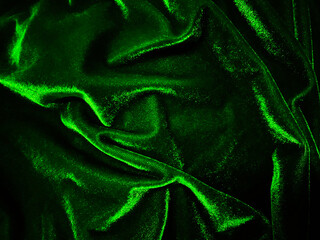 Green velvet fabric texture used as background. Empty green fabric background of soft and smooth...