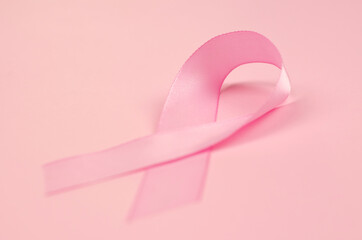 World Breast Cancer Day. Pink ribbon on a pink background, close-up