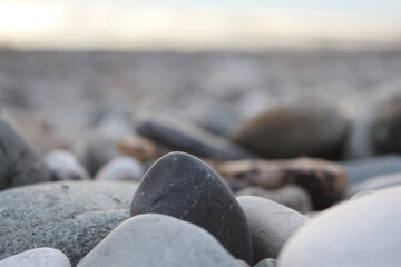 Background-the concept of relaxation, privacy, tranquility, hugge style. Large polished stones on the seashore. Close-up photos, selective focus. Macro photo.