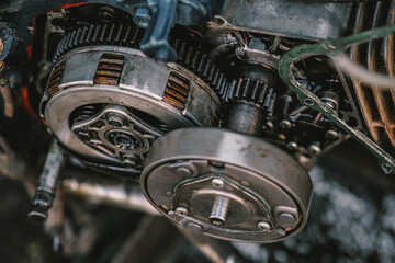 Fototapeta premium Close-up maintenance of motorcycle engine clutch system.