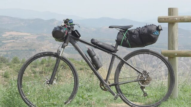 Bikepacking bike in a hilly landscape. Concept: cycle-tourism, adventures