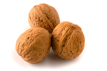 Three walnuts isolated on white background.