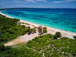 Fototapeta na wymiar Hidden beach Bahía de las Águilas drone view, beautiful view with clouds at noon, caribbean beach 