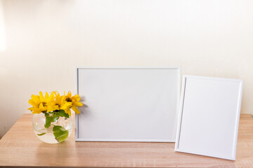 Wooden frame with yellow iris flower in glass side view, copy space, mockup, template, minimalism concept.