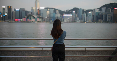 Fototapeta na wymiar Woman look at Hong Kong city