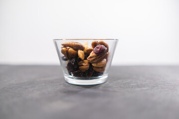 Small class of fresh nuts above black surface