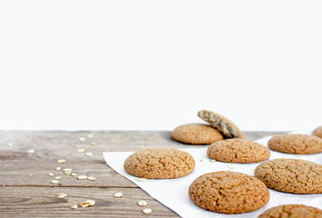 Fresh baked oatmeal cookies on white background with copy space