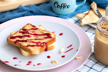 Breakfast on a plate. Toast with peanut butter and berry jam. Toaster bread. fresh sandwich for breakfast. High quality photo