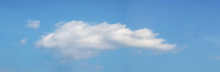 White curly cloud in the blue sky
