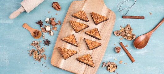 Nut corner, traditional german sweets called Nussecke, covered with chocolate