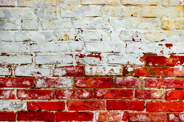Texture of a brick wall with cracks and scratches which can be used as a background