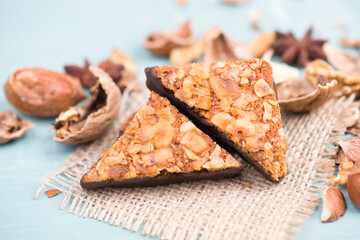 Nut corner, traditional german sweets called Nussecke, covered with chocolate