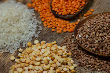 Cereals on a wooden background. Various cereals next to each other. Healthy diet