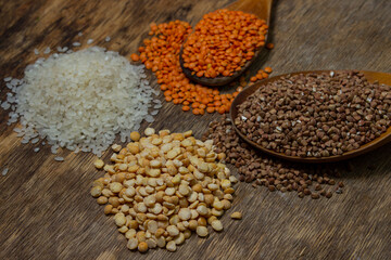 Cereals on a wooden background. Various cereals next to each other. Healthy diet