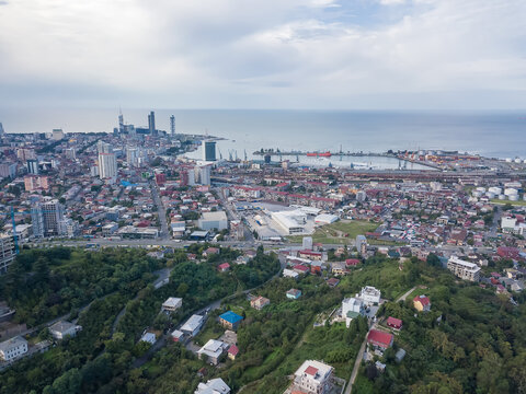 Drone view of the port, sea, city, private houses from the side of the mountain in Batumi.