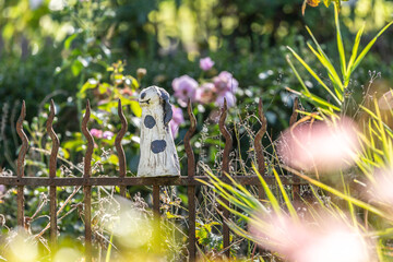 Pottery as garden deco on a fence