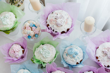 Beautiful Easter cakes on a decorated light table. A light holiday of Easter.