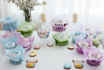 Obraz na płótnie Canvas Beautiful Easter cakes on a decorated light table. A light holiday of Easter.