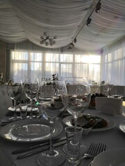 
wine glasses are on the table set in the banquet hall