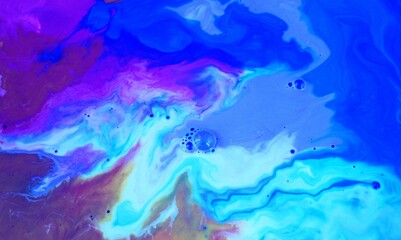 Abstract pink and blue marble background. Acrylic paint mixes freely and creates an interesting pattern. Bright saturated shades. Background for the cover of a laptop, laptop.