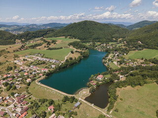 Fototapeta na wymiar Aerial view of a lake in the village of Bansky Studenec in Slovakia