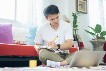 Young man online working and learning from home
