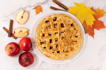 autumn apple pie with cinnamon and red apples