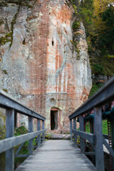 Path leading to an entrance thats in a cave, Līgatne, Latvia